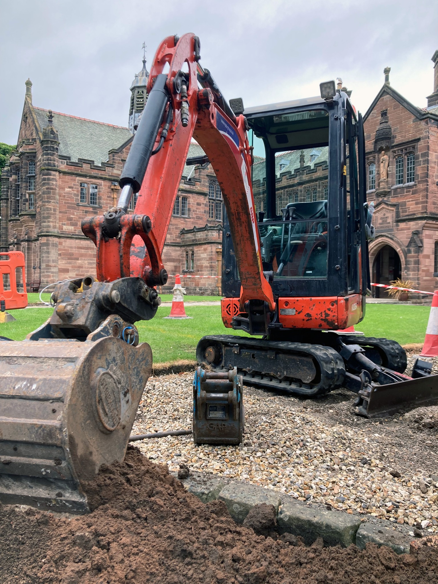 A red mini-digger on the Library lawn