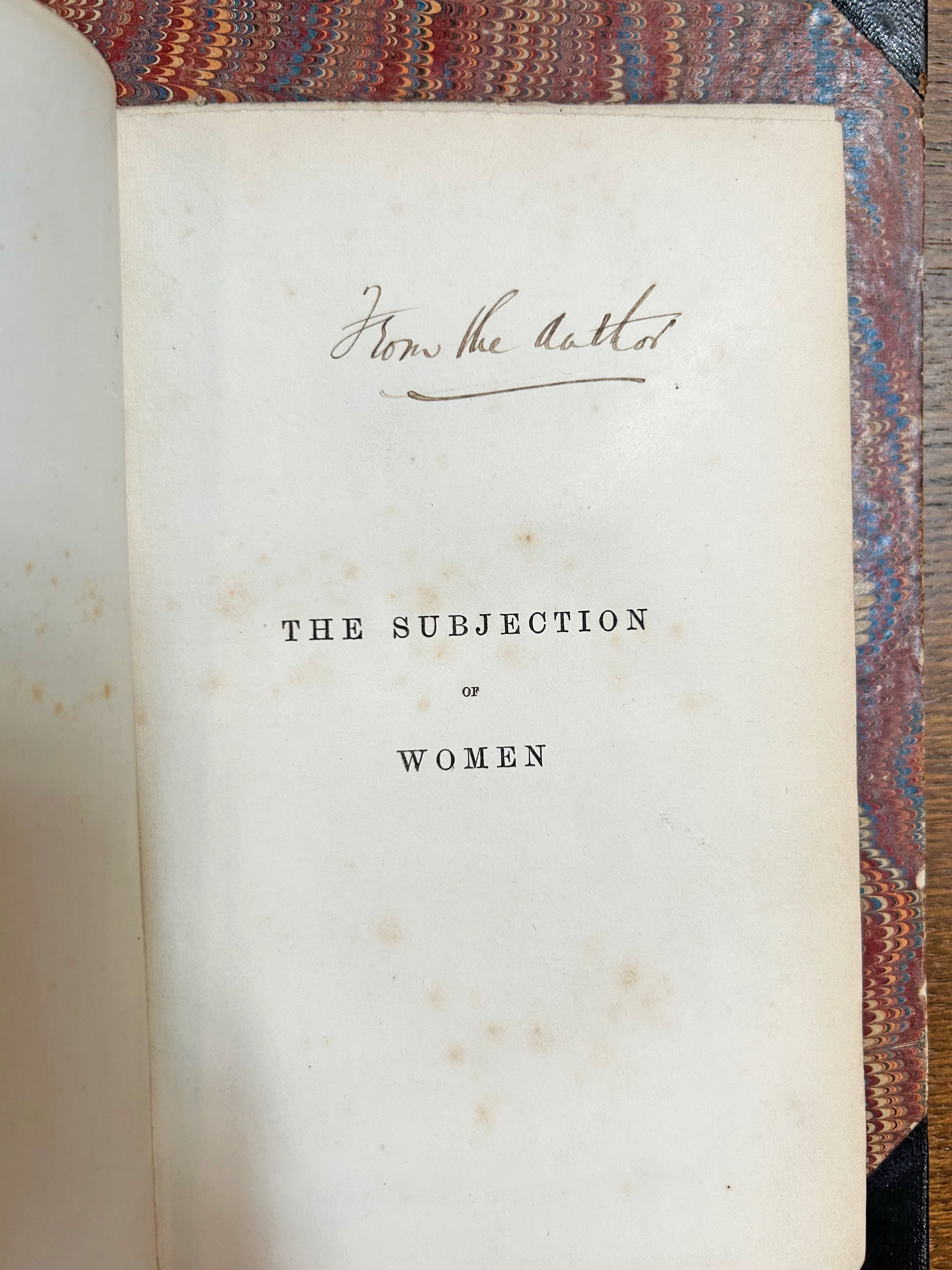 The title page from 'The Subjugation of Woman'. The title is the only printed text on the page. There is a handwritten note: from the author